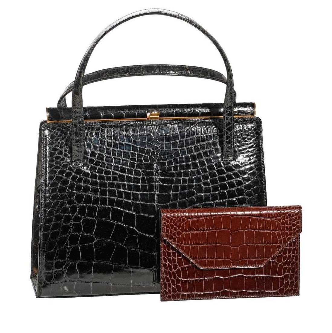 Vintage I. Magnin Black Alligator Pattern Handbag: The I. Magnin labeled circa late 1980s/early 1990s black alligator embossed pattern leather handbag with gold-toned metal frame and closure; 9" x 11 1/2" x 3" (I. Magnin store tag in pocket). Together