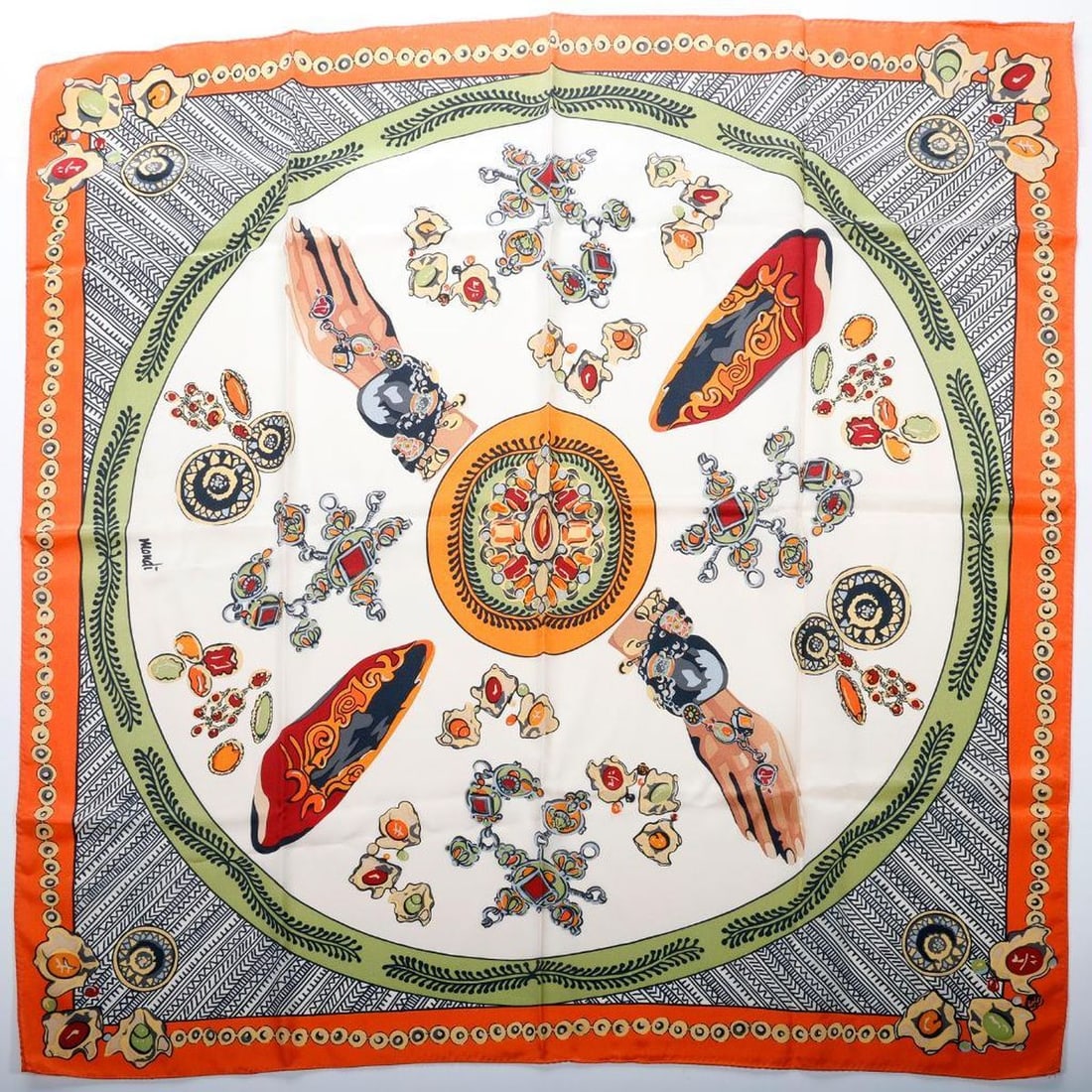 Vintage Mondi Silk Scarf, Tribal Jewelry Motif: A vintage Mondi silk scarf, with design of tribal jewelry hands, a pair of shoes, and surrounding jewelry pieces in tones of gold, orange, and green on cream ground. Approx. 35" sq. Excellen