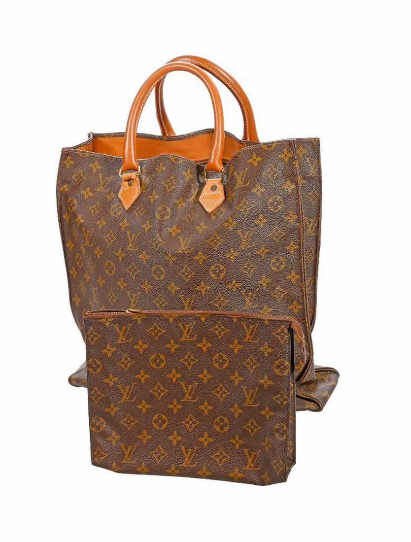 Louis Vuitton French Company Tote Bag: A vintage Louis Vuitton brown coated canvas monogram tote/handbag, leather handles, labeled Manufactured in the U.S.A., Special License to the French Co. (circa 1976-1991). 15" x 15" x 4." Very good v