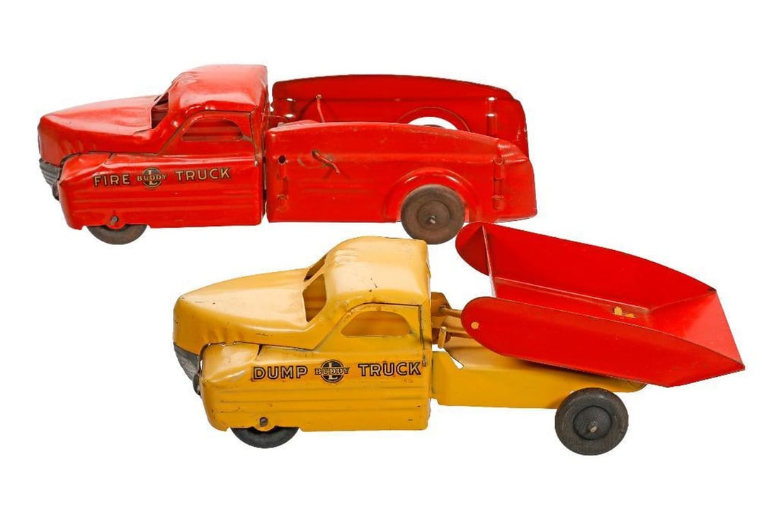 Two Buddy L Toy Trucks: Including a labeled yellow dump truck with red trunk and a labeled red fire truck with an articulated ladder, each 4.5"h x 12"l x 4"d
