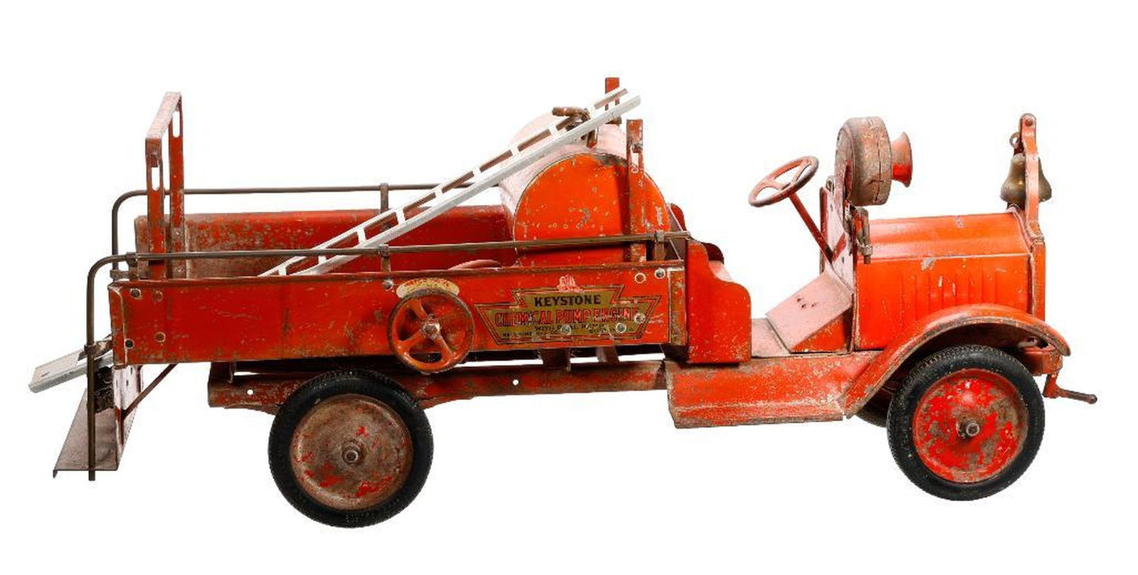 Keystone Chemical Pump Fire Engine: The orange pressed steel cab with original decal surmounted by an image of the hat on top of the decal, retaining its bell and a single ladder, 11"h x 30"l x 8"d Condition: Appears orange paint