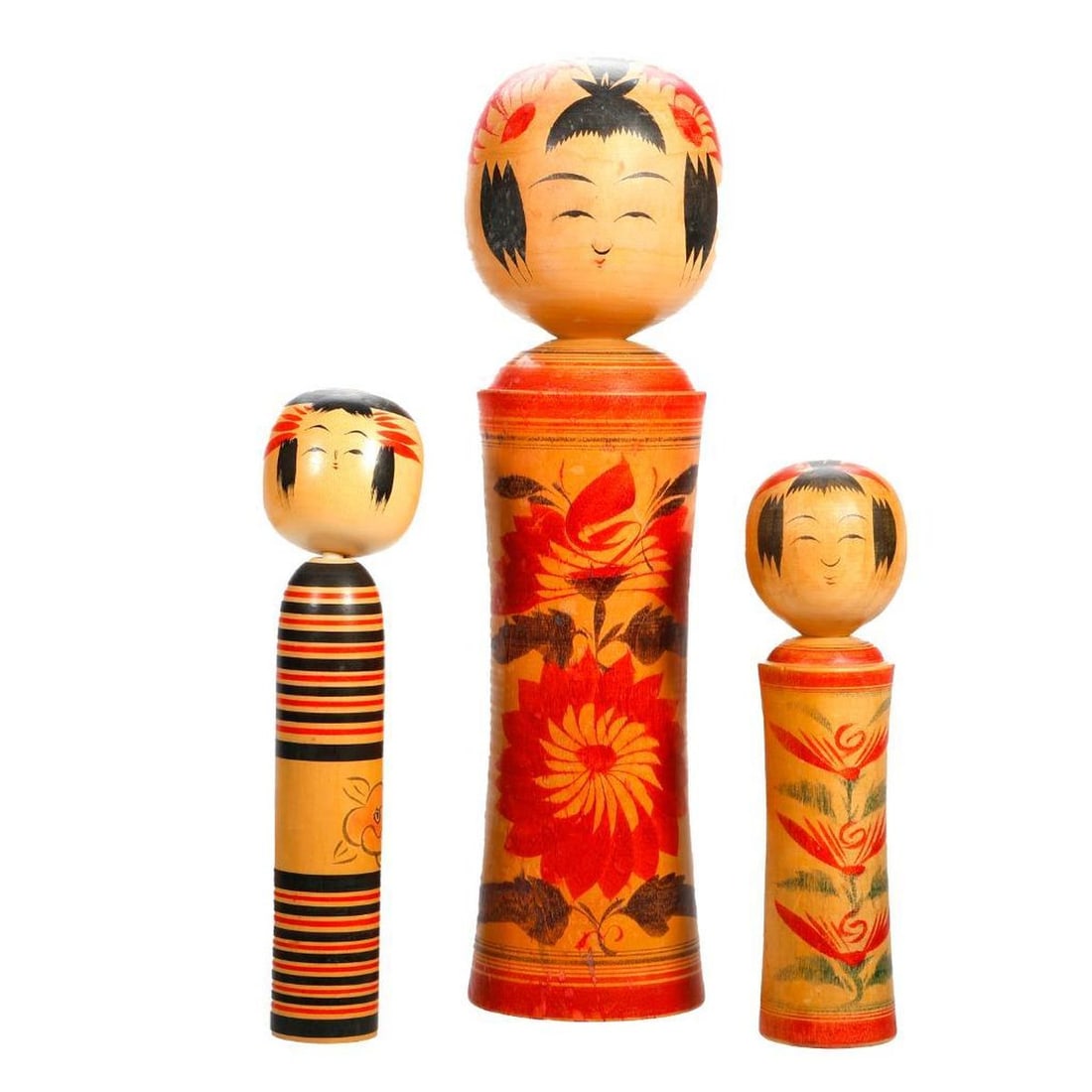 Six Japanese Kokeshi Tanka Poem or Naruko Dolls: Comprising three Showa Period dolls decorated in a chrysanthemum pattern, one signed Yazirov. Condition: discoloration and fading of colors; a Nakayama shirakaba white birch wood doll