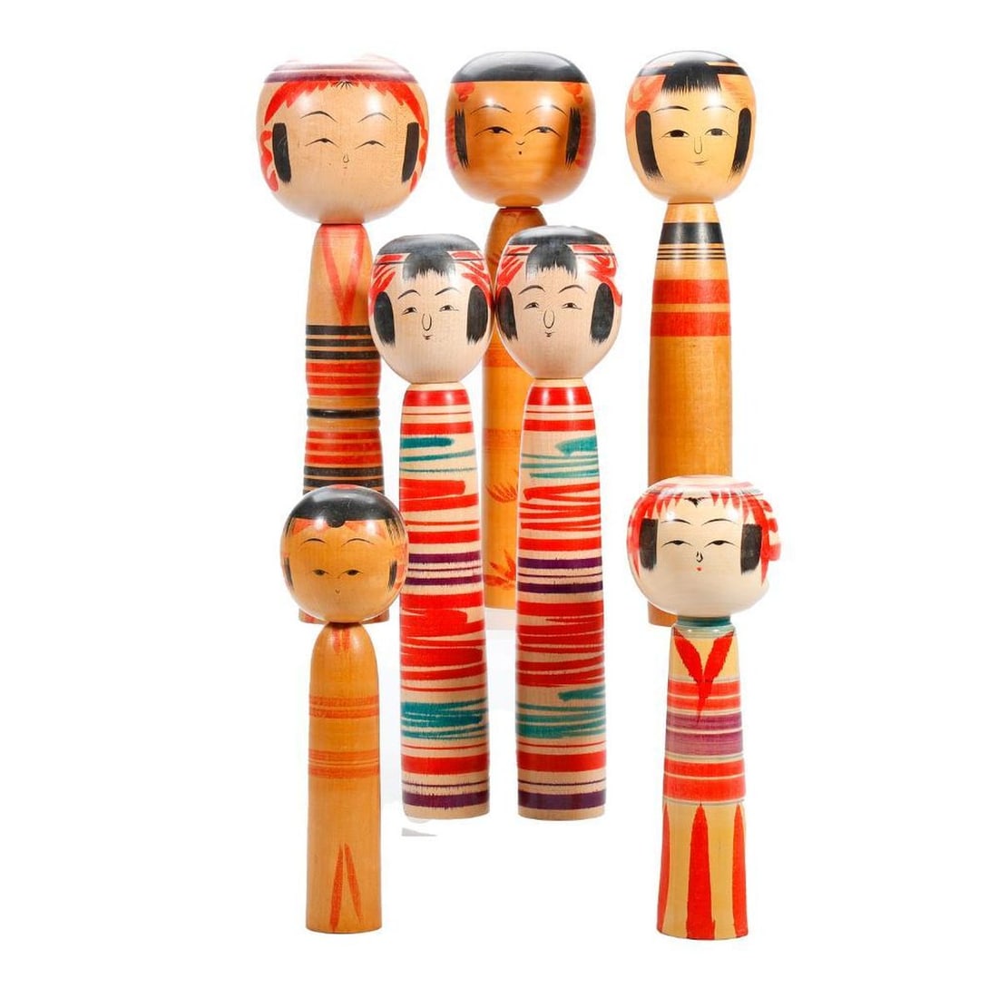Lot of Traditional Kokeshi Dolls: Each having a cylindrical body with banded design (0ne with chrysathemums) and a large round head, each signed, sizes range from 8.5" to 12.5". Condition: discoloration and fading of colors to