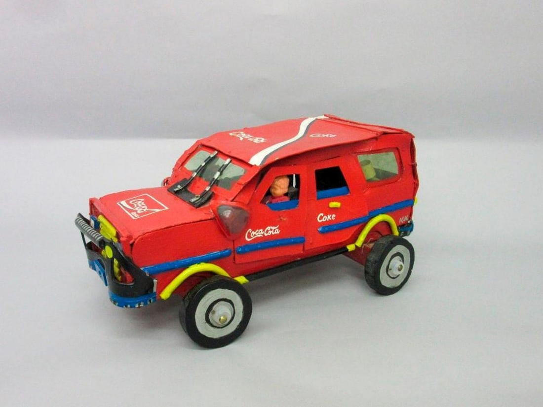 Coca-Cola truck: Painted "Coca Cola", attached figures inside. Dimensions: 8 1/2 x 9 1/2 x 17 inches (21.6 x 24.1 x 43.2 cm). SFO Museum Deaccessioning Project SFO Museum is conducting a review and downsizing of our