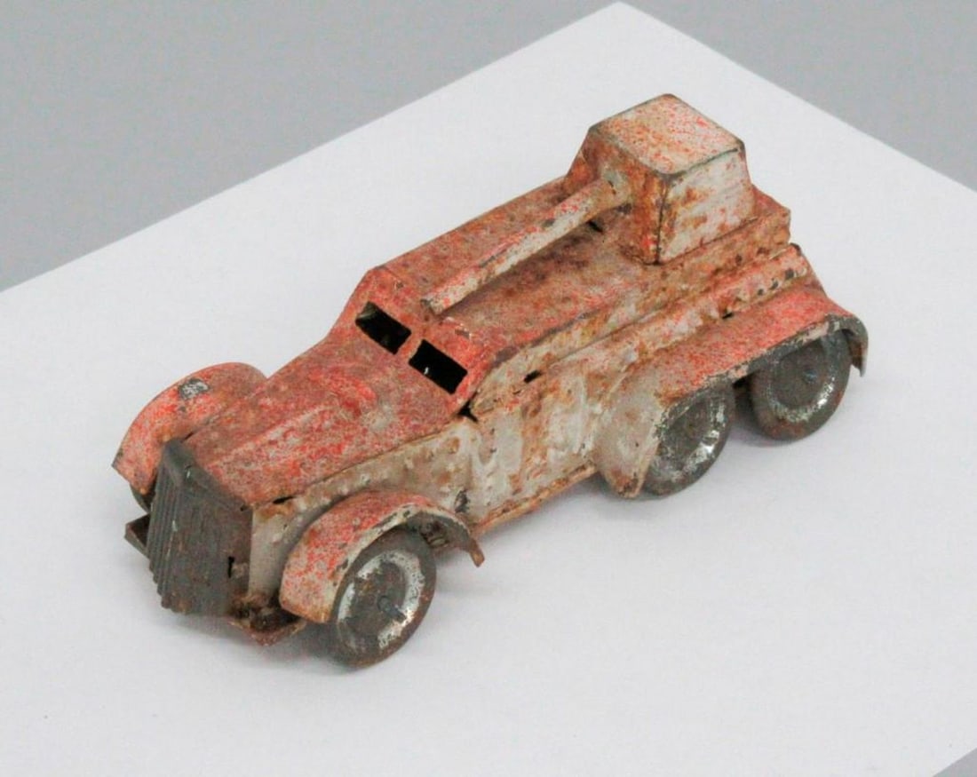 Vintage Armored Truck: A toy armored car with six wheels. Dimensions: 1 3/4 x 1 3/4 x 4 inches (4.4 x 4.4 x 10.2 cm). {Worn condition} SFO Museum Deaccessioning Project SFO Museum is conducting a review and downsizing of