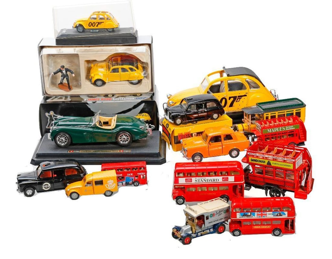 Lot of "English" Toy Cars and Buses: Including an Italian Burago 1948 green Jaguar XK120 overall on plastic stand 2.5"h x 9.5" x 5"d; (3) yellow James Bond Citroen 2CV cars, by Corgi and a cased Solido; a 1983 Matchstick Renault