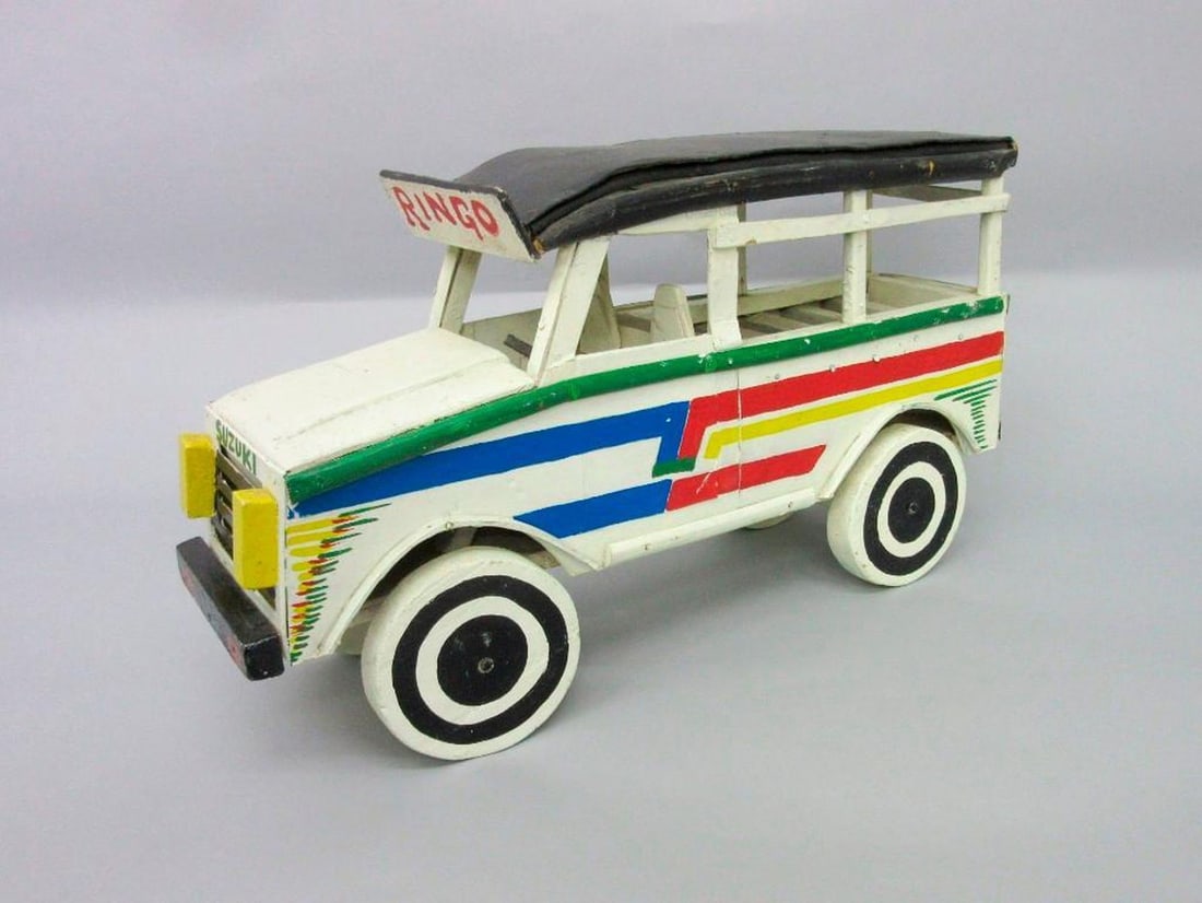 Japanese Suzuki Edwards Ringo truck: Written on it: "Suzuki" and "Ringo", "Ringo art". Dimensions: 10 1/2 x 4 1/2 x 19 inches (26.7 x 11.4 x 48.3 cm). SFO Museum Deaccessioning Project SFO Museum is conducting a review and downsizing of