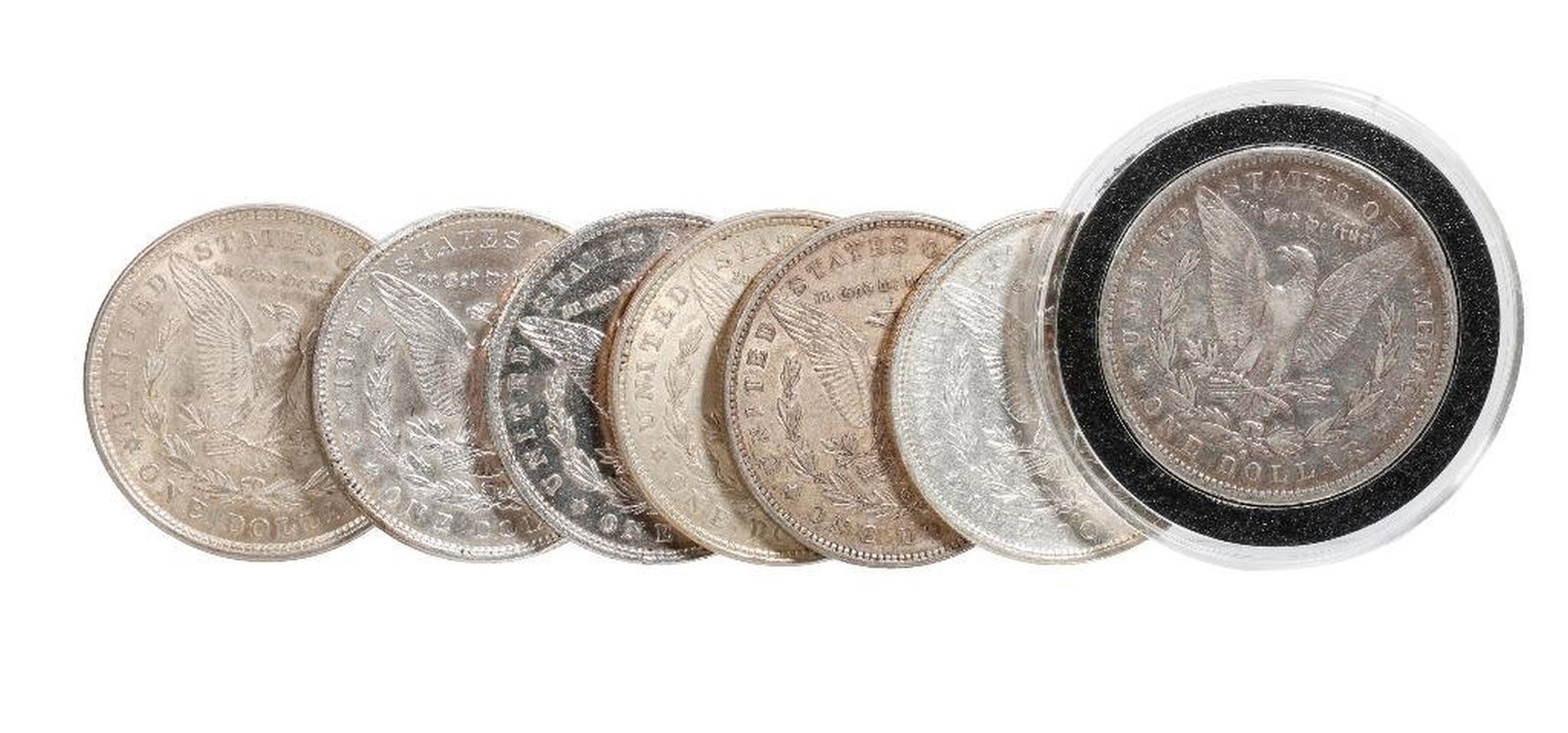 Seven Morgan Silver Dollars: Comprising (2) 1879-o (one Au+); a 1882 and 1882-S (both VF);1896 (Au); (2) 1921 Morgans (Au) 