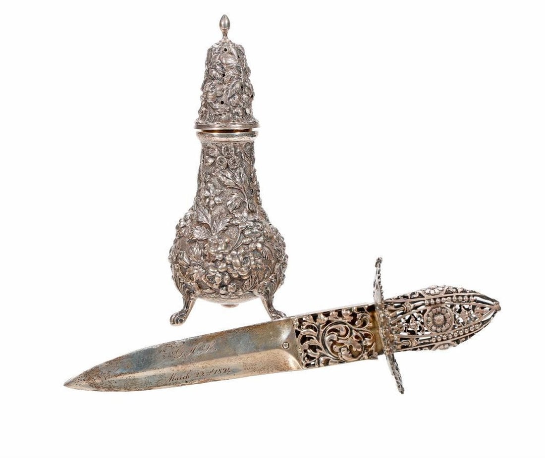 Two Art Nouveau Sterling Items: a Shiebler letter opener fashioned after a Toleda dagger #5473, inscribed "GHL March 22nd 1894", 8"l;and a Stieff floral repousse tripod shaker #12B, 5.75"h, total silver weight 211g