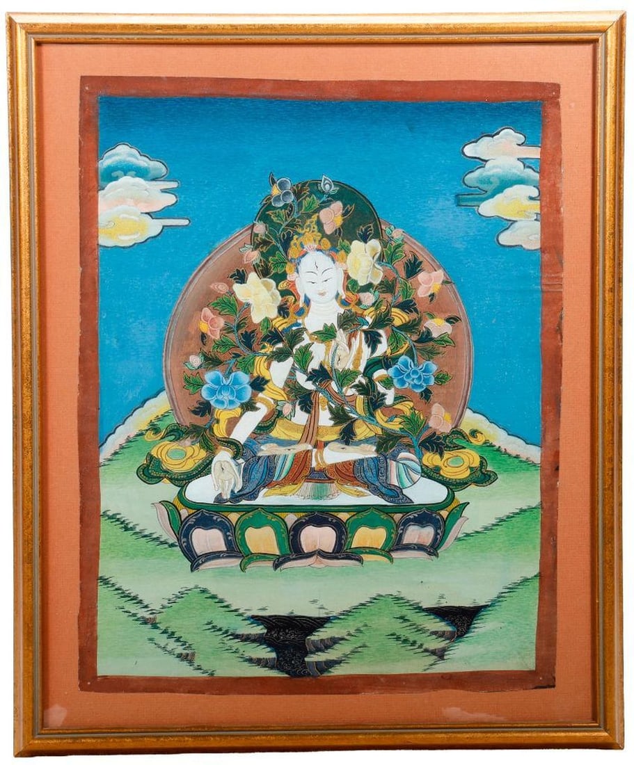 White Tara Thangka Painting: A hand-painted image of the White Tara female Buddha (Sitatara) with seven eyes, in verada mudra and holding a blooming lotus stalk, seated on a lotus throne on a grassy hill. 15 1/4" x 12" 