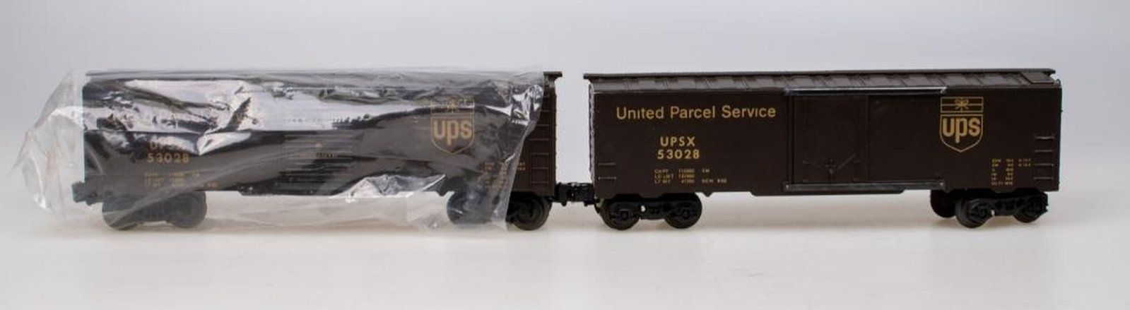 (6) KMT/Frank's Roundhouse UPS Boxcars. Brown with gold lettering. - 2