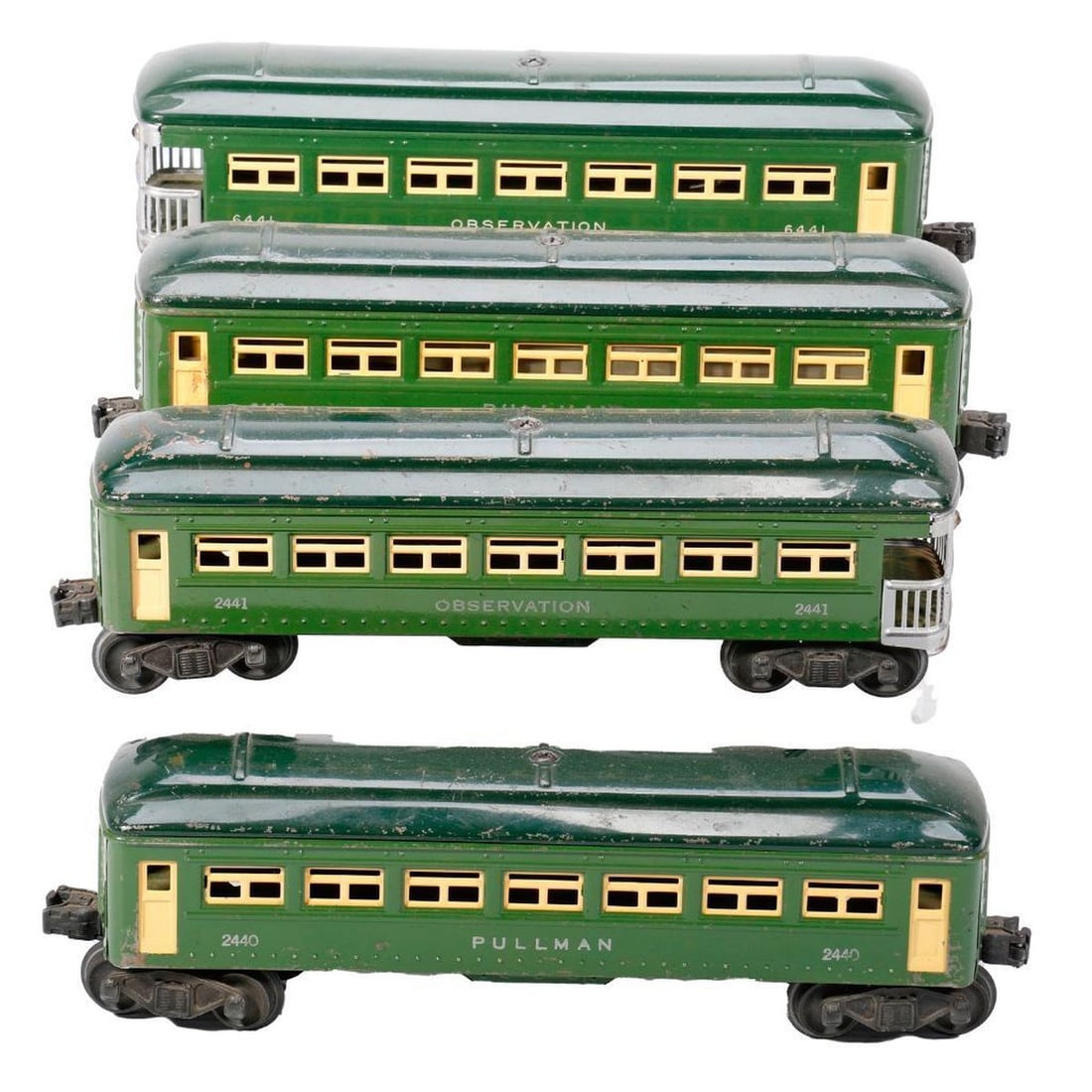 (4) Lionel O Gauge Postwar Green Metal Passenger Cars: (4) Lionel O Gauge Postwar Green Metal Passenger Cars 2440 Pullman Trucks and couplers intact. Paint has wear and scratches from use. 2440 Pullman. Trucks and couplers intact. Paint has wear and scrat