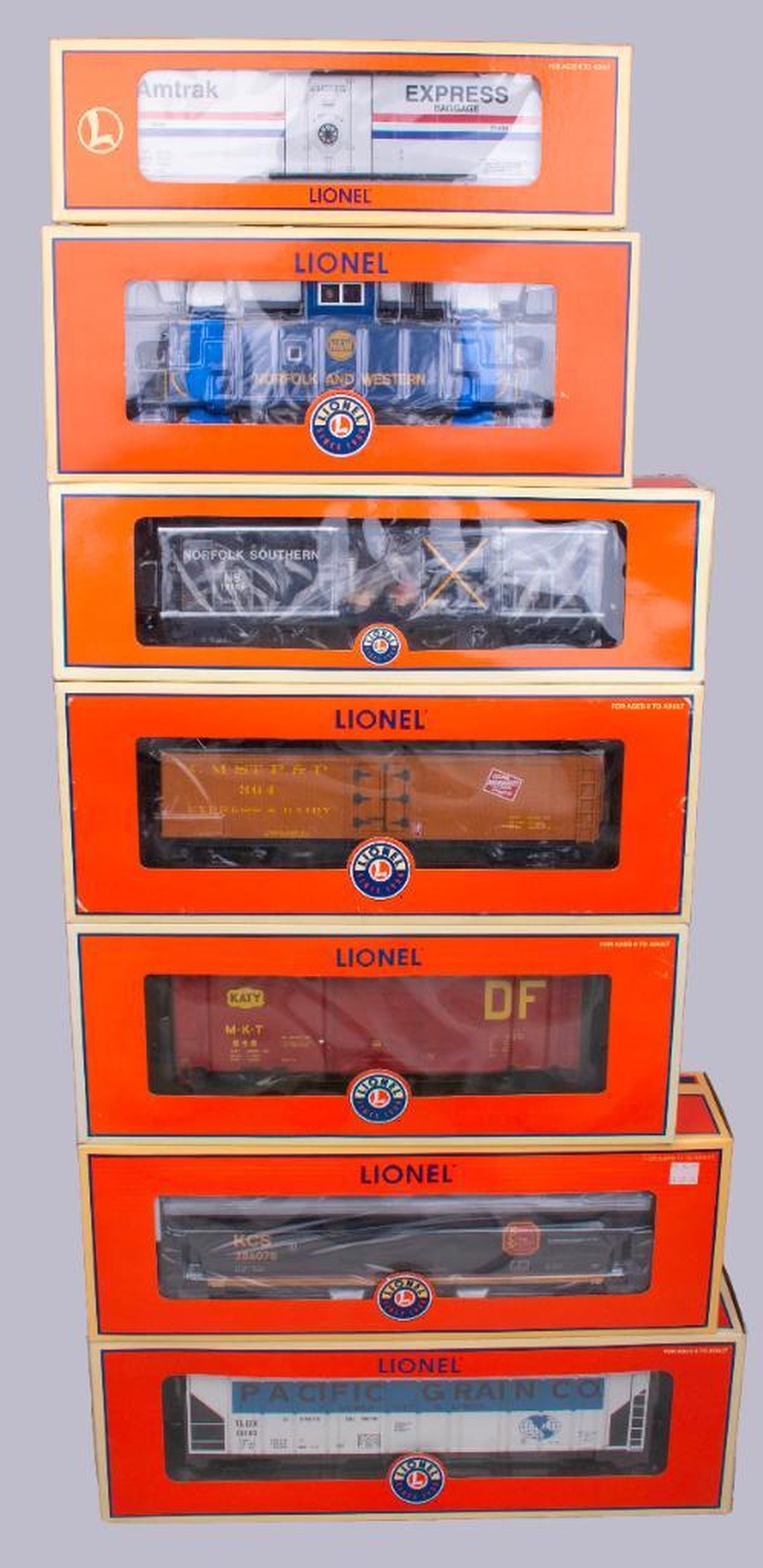 (7) Lionel O Gauge Modern Era Freight Cars: (7) Lionel O Gauge Modern Era Freight Cars 6-19585 Norfolk Southern Transparent Test Car 6-27136 Pscific Grain PS-2 Covered Hopper 6-27211 Missouri-Kansas PS-1 Boxcar 6-27413 #286078 Kansas City South