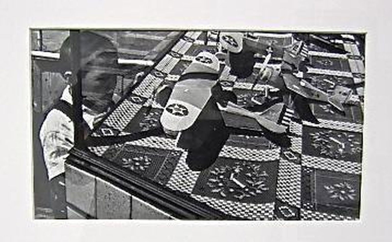 John Gutmann (1905-1998), Chinese Boy with Warplane Models, San Francisco: Artist: John Gutmann (1905-1998). Title/Description: Chinese Boy Looking at Display of Warplane Models, San Francisco. Later print of 1938 image. Label verso: Fraenkel Gallery, San Francisco label ind