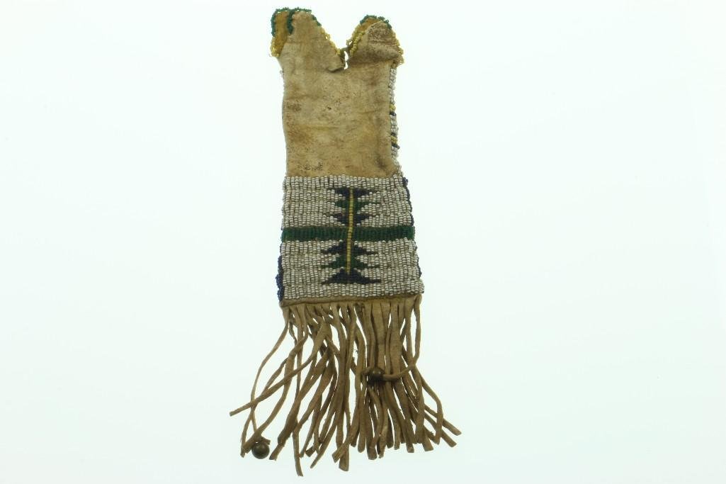 A central Plains beaded paint bag: With yellow dyed interior. Turner Auctions + Appraisals is pleased to present basketry and other items from Native American and other indigenous cultures from the private collection and estate of Pete
