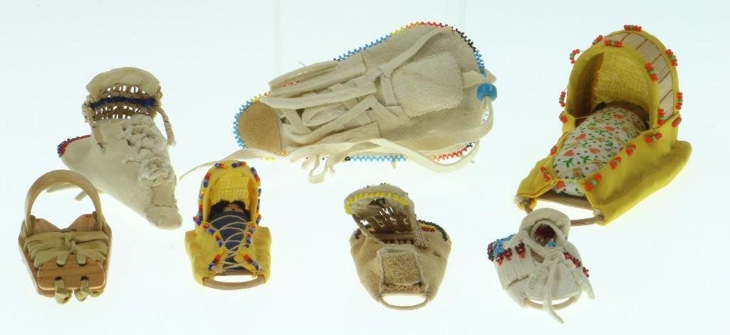 Seven Southwest and Great Basin miniature cradles: Navajo, Apache and Paiute. Turner Auctions + Appraisals is pleased to present basketry and other items from Native American and other indigenous cultures from the private collection and estate of Pete