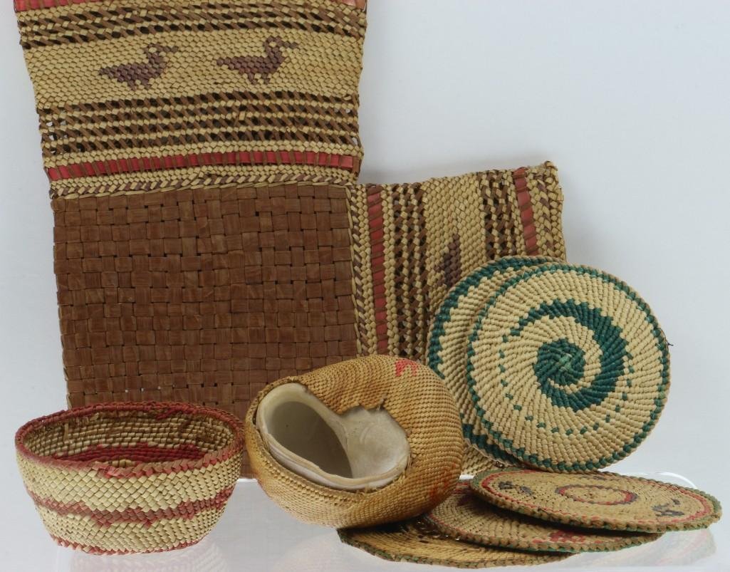 Collection of Makah basketry items: Including two covered shells, a wall pocket and an example with pine needle weave. Turner Auctions + Appraisals is pleased to present basketry and other items from Native American and other indigenous