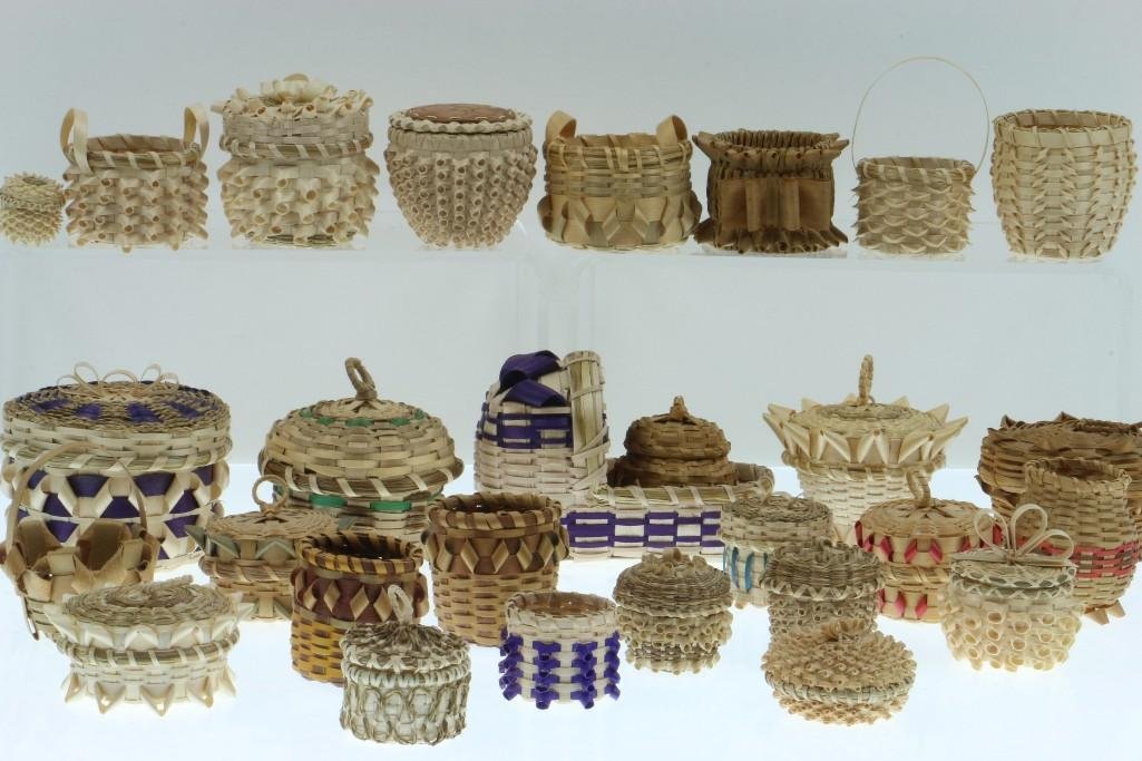 Collection of Great Lakes and Eastern Woodlands: Great Lakes and Eastern Woodlands basketry miniatures including a model cradle. Turner Auctions + Appraisals is pleased to present basketry and other items from Native American and other indigenous cu