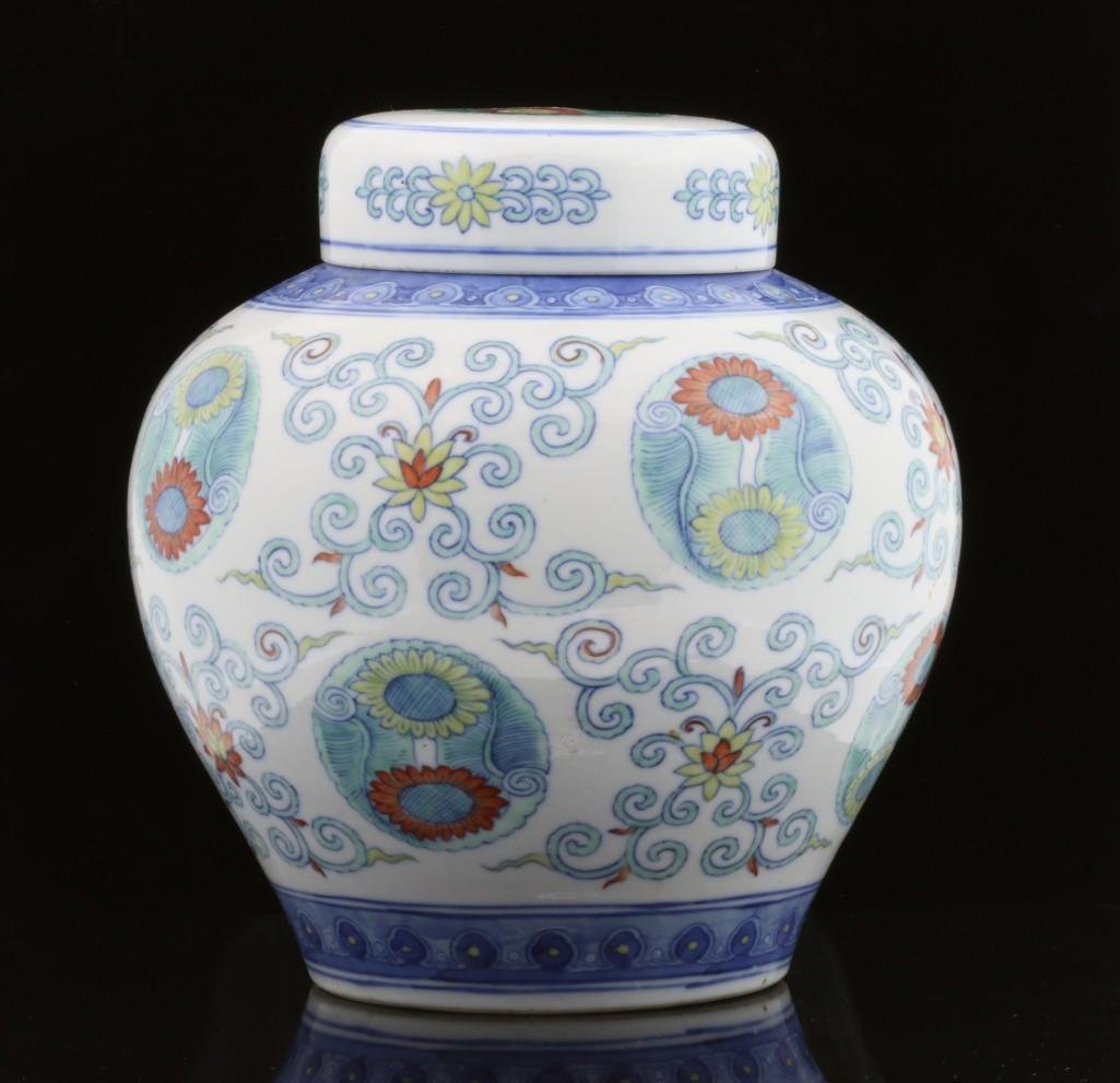 A DOUCAI COVERED GINGER JAR, CHINA, 19TH CENTURY: A 19th century Chinese Doucai covered ginger jar with Qianlong Mark. Height: 8 inches