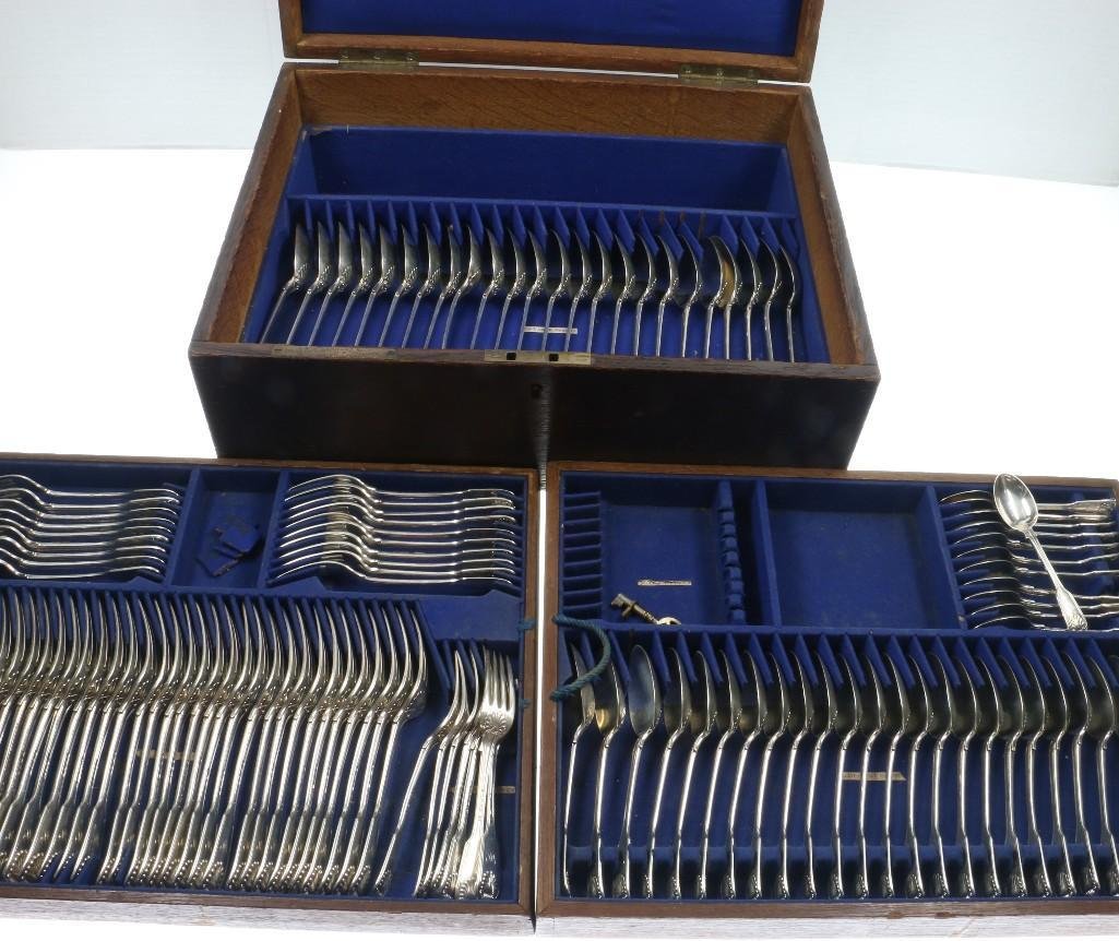 ASSEMBLED GROUP OF VICTORIAN STERLING SILVER FLATWARE: Second half 19th Century by various makers; in the Fiddle, Thread, and Shell pattern. Comprising of approximately 35 dinner forks, 26 luncheon forks, 12 teaspoons, 24 tablespoons, for a total of appro