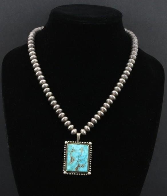 Navajo necklace: By Edison Sandy Smith, on a silver bead chain Length: 20 1/2 inches Pendant: 2 inches Additional Description: From the Estate of Margaret Taylor, Sedona, Arizona Margaret Taylor was a teacher for many
