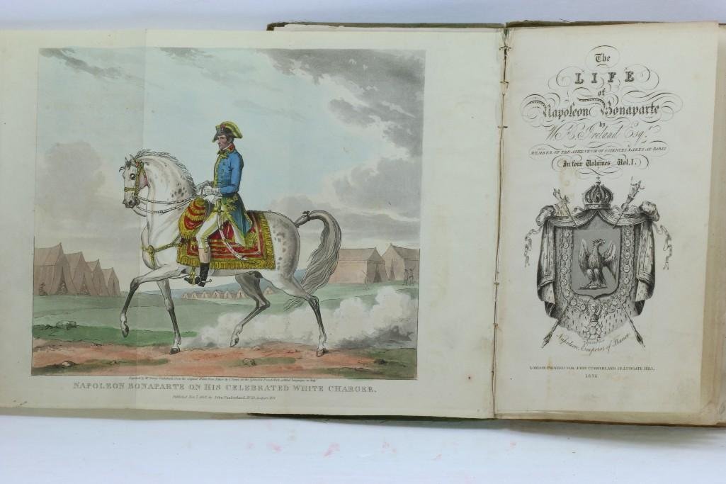 IRELAND, CRUIKSHANK. Illustrator The Life of Napoleon: Ireland, William Henry. The Life of Napoleon Bonaparte. London: John Cumberland, 1828. 4 volumes. 8vo. Original green buckram boards with paper spine labels, leaves untrimmed. Some covers detached, vo