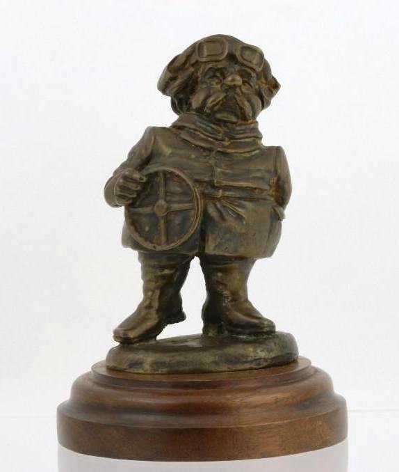EARLY MOTORIST MASCOT: Height: 4 inches Sy and Ronnie Margolis's eclectic collection features a wide range of hood or fender ornaments, from about 1909 to recent times. Most date from the 1920s and 1930s, with many from the