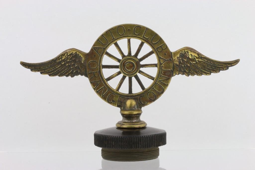 AUTO CLUB ORANGE COUNTY MASCOT: Wingspan: 7 1/2 inches Height: 4 1/2 inches Sy and Ronnie Margolis's eclectic collection features a wide range of hood or fender ornaments, from about 1909 to recent times. Most date from the 1920s an