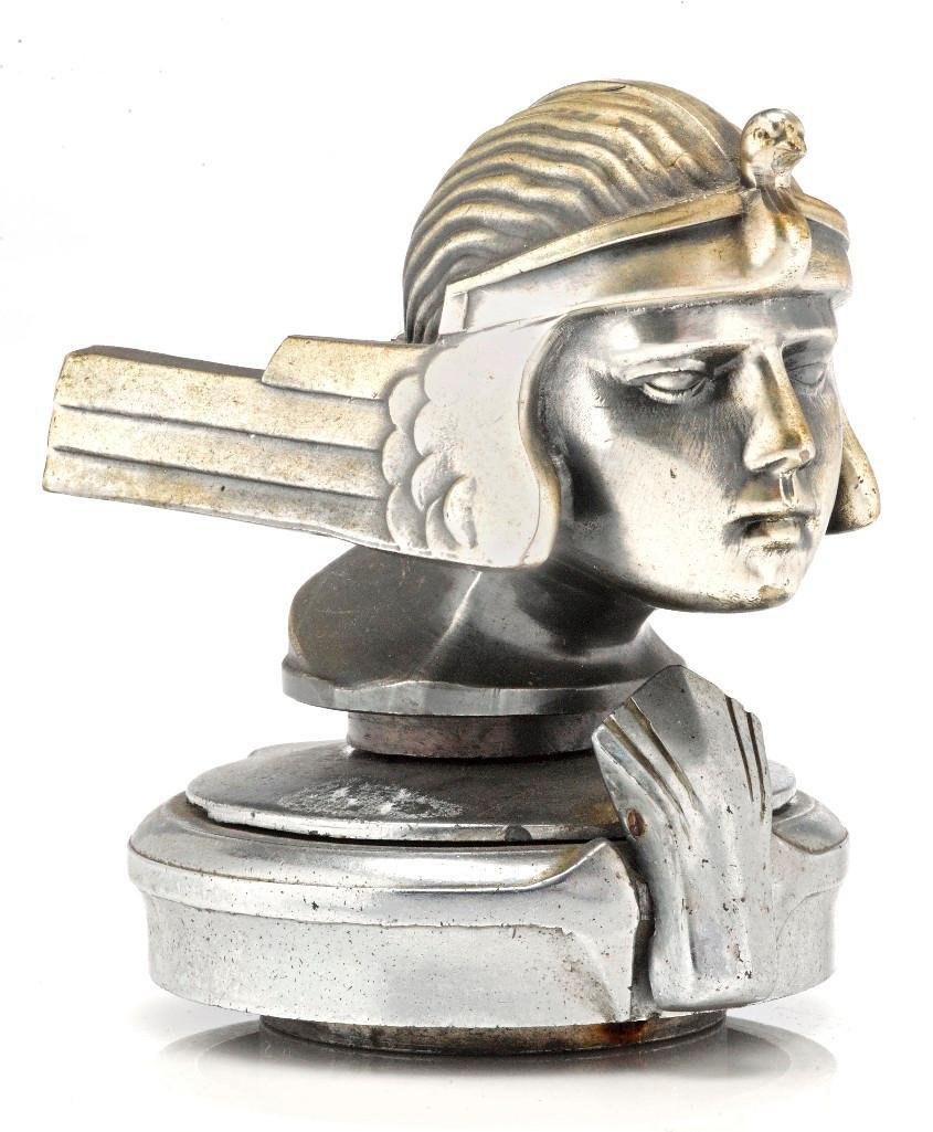 STUTZ RA REPRODUCTION MASCOT, 1935-36: Height: 4 1/4 inches Sy and Ronnie Margolis's eclectic collection features a wide range of hood or fender ornaments, from about 1909 to recent times. Most date from the 1920s and 1930s, with many from