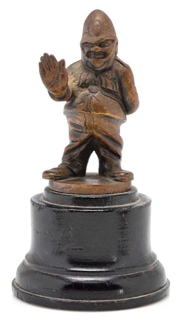 SMALL ENGLISH BOBBY MASCOT: Height: 4 inches Sy and Ronnie Margolis's eclectic collection features a wide range of hood or fender ornaments, from about 1909 to recent times. Most date from the 1920s and 1930s, with many from the