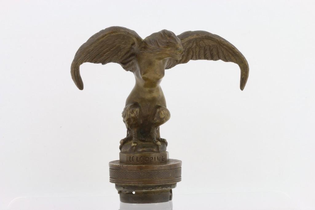 LE LOOPING MASCOT BY SZEKIKE: Signature on side of base Height: 6 inches Sy and Ronnie Margolis's eclectic collection features a wide range of hood or fender ornaments, from about 1909 to recent times. Most date from the 1920s and