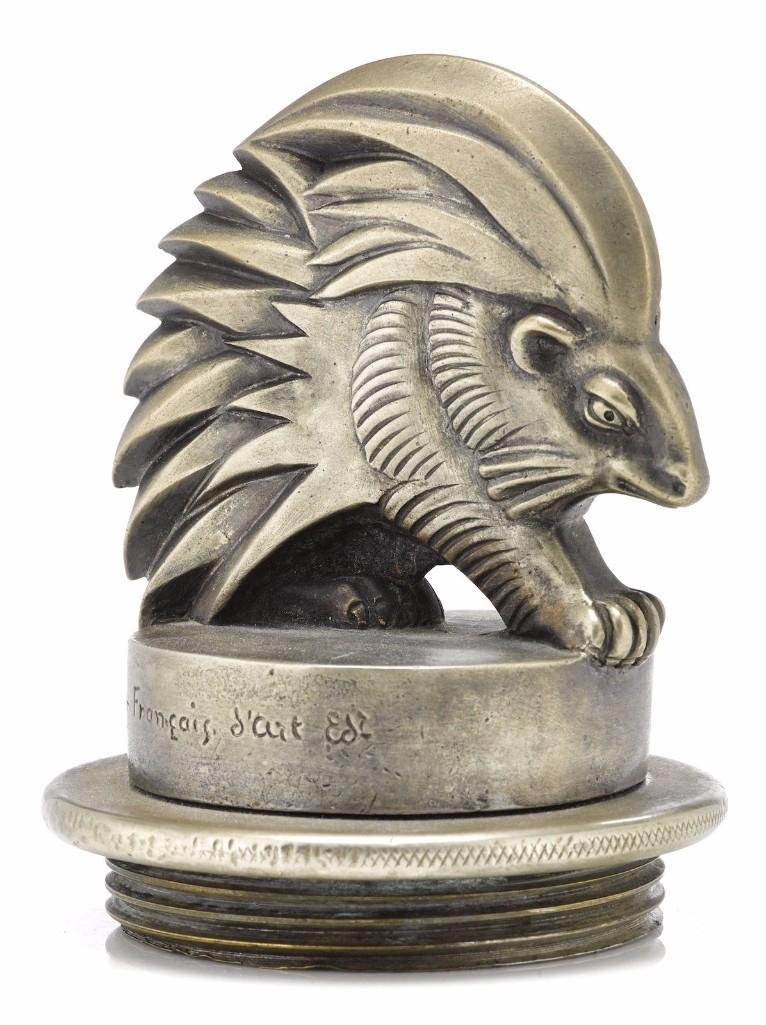 BIZETTE LINDET MASCOT BY COMPTOIR FRANCAIS: Signature and 'd'cut Ed' on side of base Height: 4 1/4 inches Sy and Ronnie Margolis's eclectic collection features a wide range of hood or fender ornaments, from about 1909 to recent times. Most