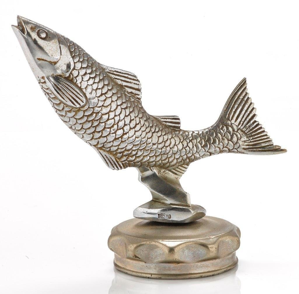 LEAPING FISH MASCOT BY DESMO: Height: 5 1/4 inches Sy and Ronnie Margolis's eclectic collection features a wide range of hood or fender ornaments, from about 1909 to recent times. Most date from the 1920s and 1930s, with many from