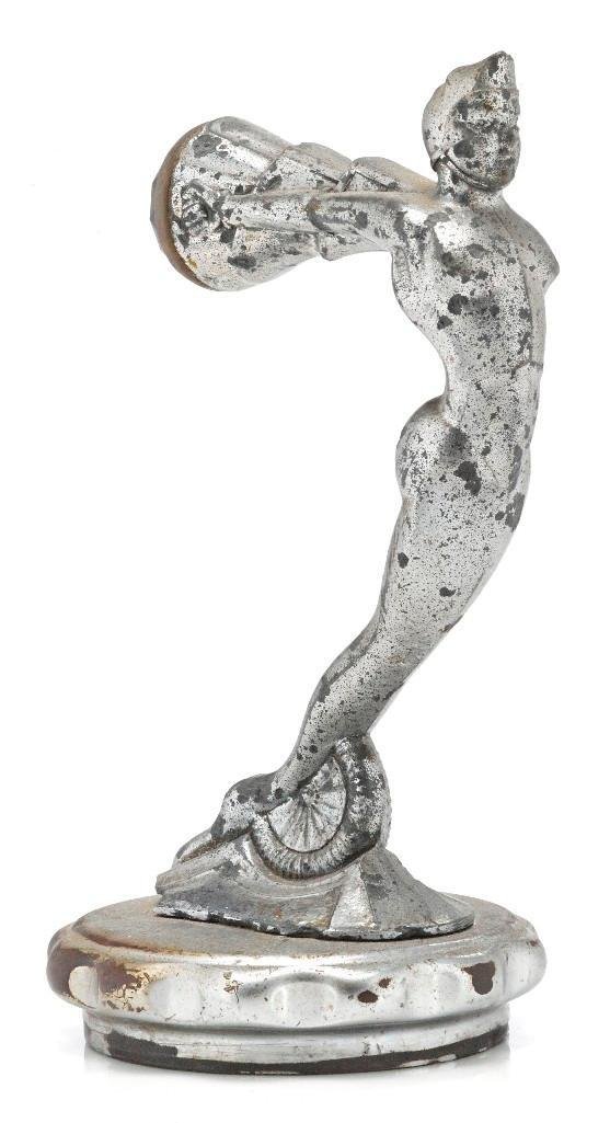 STYLIZED GOD WITH RED JEWEL MASCOT: Height: 6 1/4 inches Sy and Ronnie Margolis's eclectic collection features a wide range of hood or fender ornaments, from about 1909 to recent times. Most date from the 1920s and 1930s, with many from
