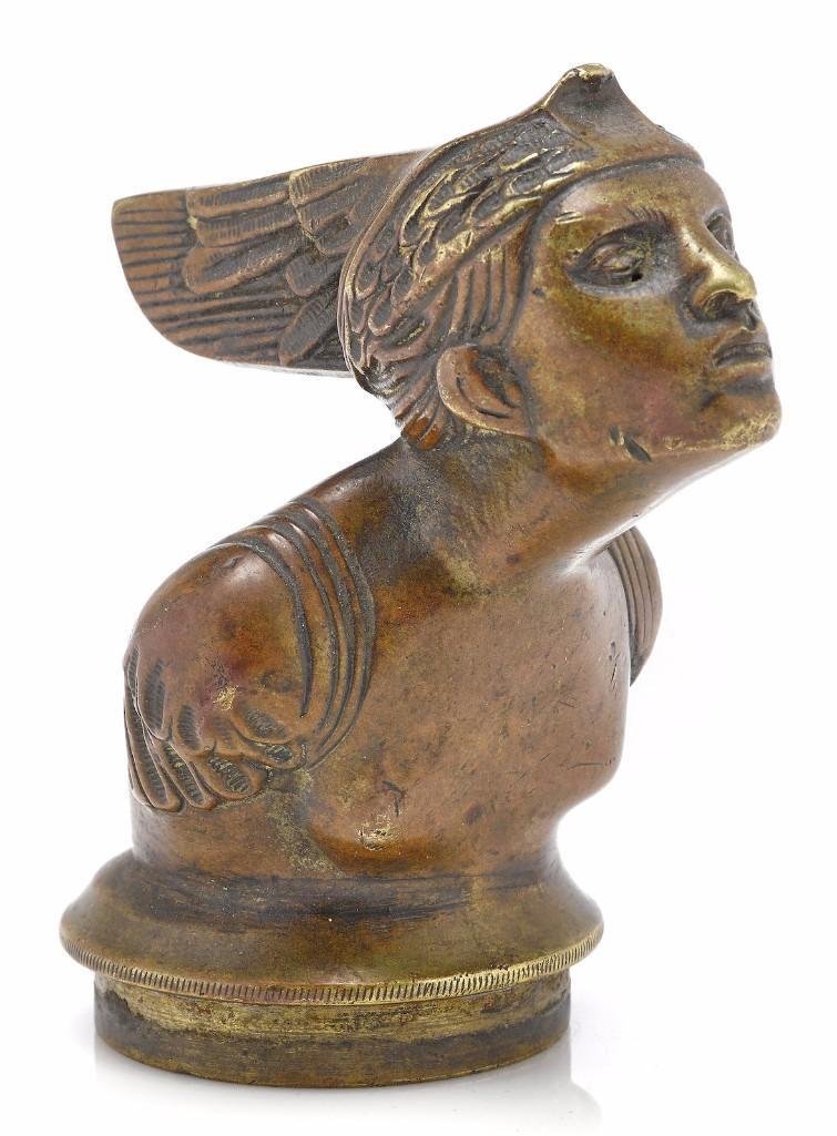 BUST OF CLEOPATRA MASCOT: Height: 4 1/4 inches Sy and Ronnie Margolis's eclectic collection features a wide range of hood or fender ornaments, from about 1909 to recent times. Most date from the 1920s and 1930s, with many from