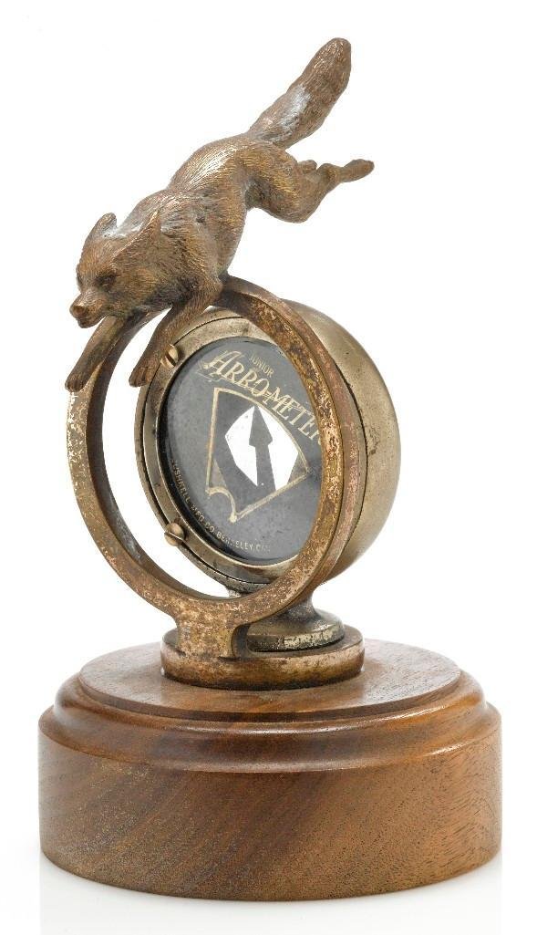 FOX OVER RING WITH JUNIOR ARRO-METER MASCOT: Height: 6 3/4 inches Sy and Ronnie Margolis's eclectic collection features a wide range of hood or fender ornaments, from about 1909 to recent times. Most date from the 1920s and 1930s, with many from