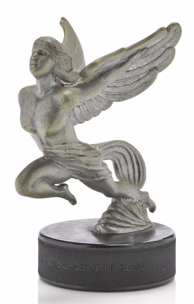 WINGED ANGEL MASCOT: Height: 5 1/2 inches Sy and Ronnie Margolis's eclectic collection features a wide range of hood or fender ornaments, from about 1909 to recent times. Most date from the 1920s and 1930s, with many from