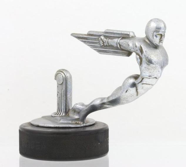 WINGED GOD MASCOT, 1920: Length: 6 inches Sy and Ronnie Margolis's eclectic collection features a wide range of hood or fender ornaments, from about 1909 to recent times. Most date from the 1920s and 1930s, with many from the