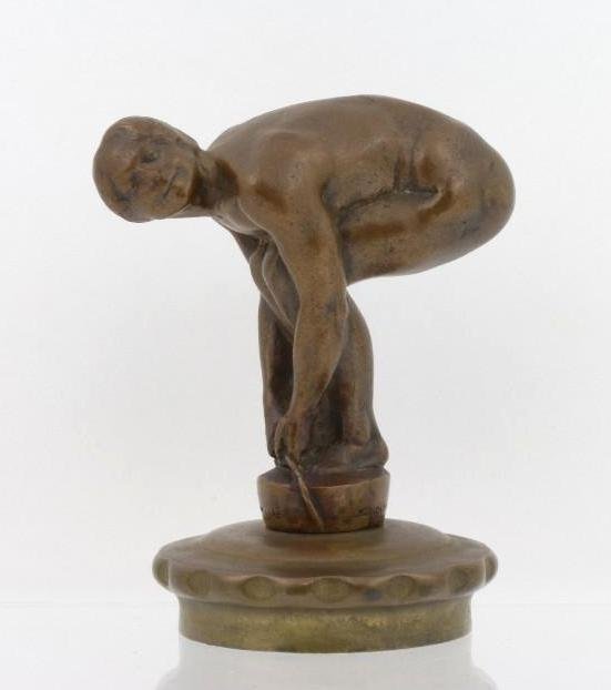 MALE NUDE MASCOT BY W.D. PADDOCK, 1905: Signature and copyright on base Height: 4 3/4 inches Sy and Ronnie Margolis's eclectic collection features a wide range of hood or fender ornaments, from about 1909 to recent times. Most date from the