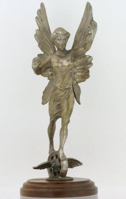 WINGED GODDESS ON WINGED WHEEL MASCOT, FRENCH, C. 1918: Repair to one wing on wheel Height: 10 inches Sy and Ronnie Margolis's eclectic collection features a wide range of hood or fender ornaments, from about 1909 to recent times. Most date from the 1920s 