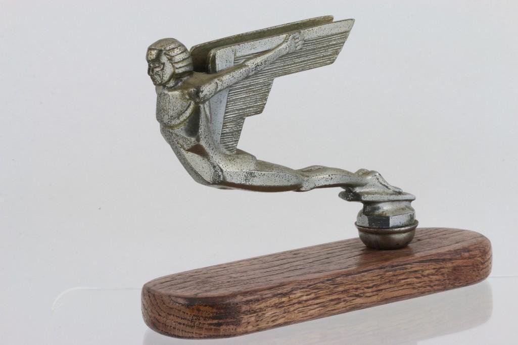 STYLIZED ICARUS MASCOT: Length: 6 inches Sy and Ronnie Margolis's eclectic collection features a wide range of hood or fender ornaments, from about 1909 to recent times. Most date from the 1920s and 1930s, with many from the