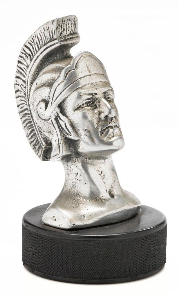TROJAN HEAD MASCOT, 1930: Height: 5 inches Note: The sale features 110 lots related to the 1932 Olympics in Los Angeles, including car mascots, radiator badges, license plates, banners, maps, pennants, booklets, tickets and ep