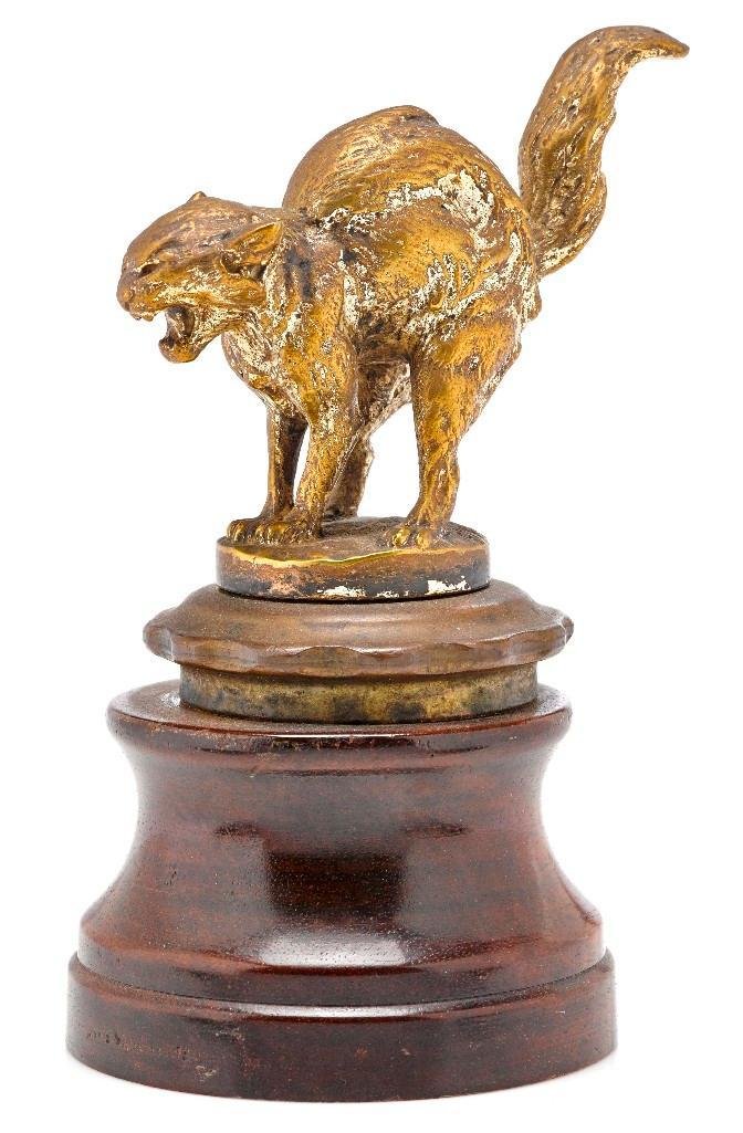 CAT FURY MASCOT BY CH PAILLET: Height: 6 inches Note: The sale features 110 lots related to the 1932 Olympics in Los Angeles, including car mascots, radiator badges, license plates, banners, maps, pennants, booklets, tickets and ep
