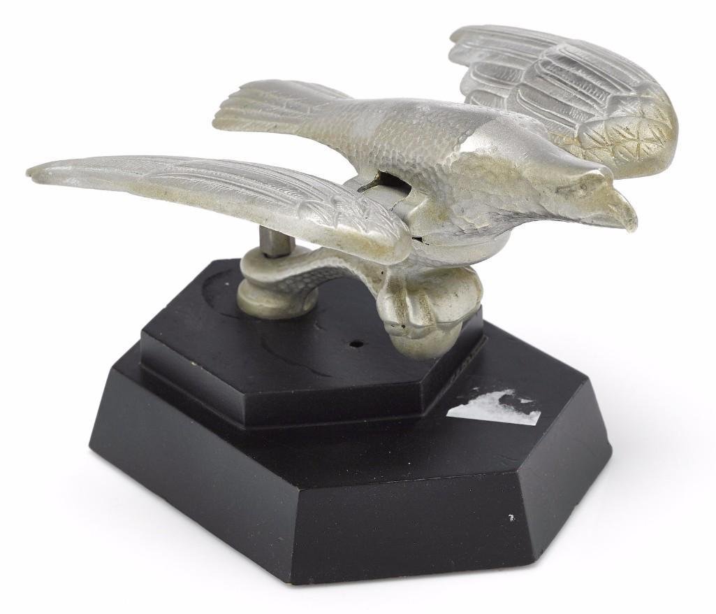 RARE 'EAGLE' MASCOT WITH FLAPPING WINGS, CIRCA 1930: Length: 7 inches Note: The sale features 110 lots related to the 1932 Olympics in Los Angeles, including car mascots, radiator badges, license plates, banners, maps, pennants, booklets, tickets and ep