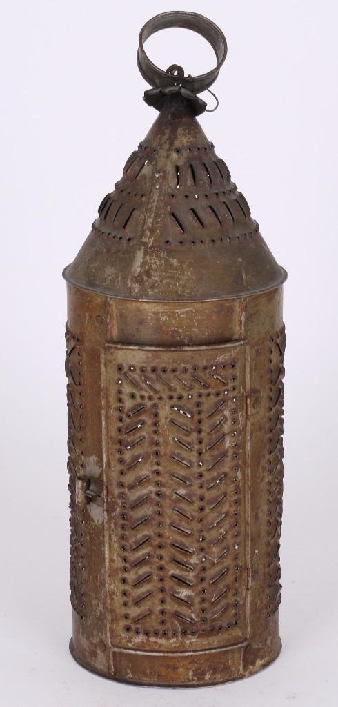 VINTAGE PUNCHED TIN LANTERN: GREATEST HEIGHT 16 INCHES, DIAMETER 5 1/4 INCHES. Turner Auctions + Appraisals is pleased to present the Americana Collection of the late Alice S. Reynolds. Offering 180 lots, the online sale features