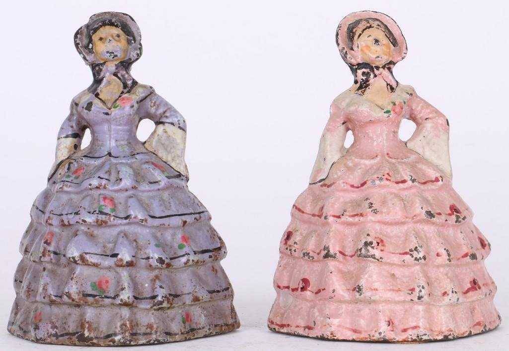TWO CAST IRON CHRINOLINE LADY DOOR STOPS: EARLY 20TH CENTURY, HEIGHT 4 1/2 INCHES. Turner Auctions + Appraisals is pleased to present the Americana Collection of the late Alice S. Reynolds. Offering 180 lots, the online sale features diverse 
