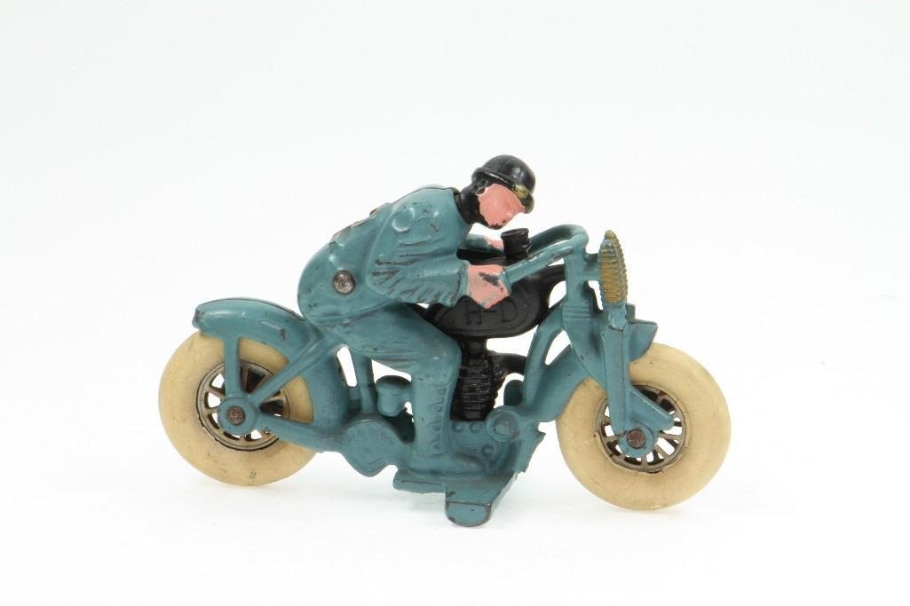 Harley Davidson Motorcycle Racer: Hubley; Painted Cast Iron, Stamped Steel Rims, White Rubber Tires, Features Unusual Swivelling Riders Head; Excellent Condition, 6 1/2"L Notes:Turner Auctions + Appraisals is pleased to feature t