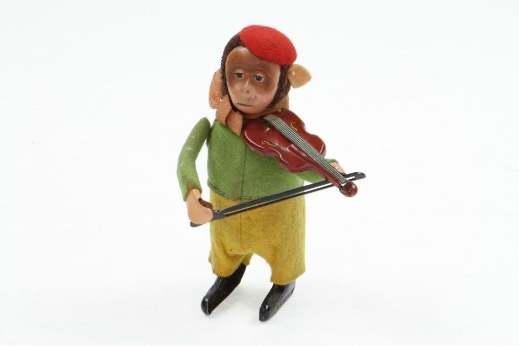 Schuco Animated Monkey with Violin: Tin Litho Construction, Felt Clothing, Clockwork Action, Very Good Condition, 4 1/2"H Notes:Turner Auctions + Appraisals is pleased to feature the Anita & Sedwick Hellman Toy Collection. Offering