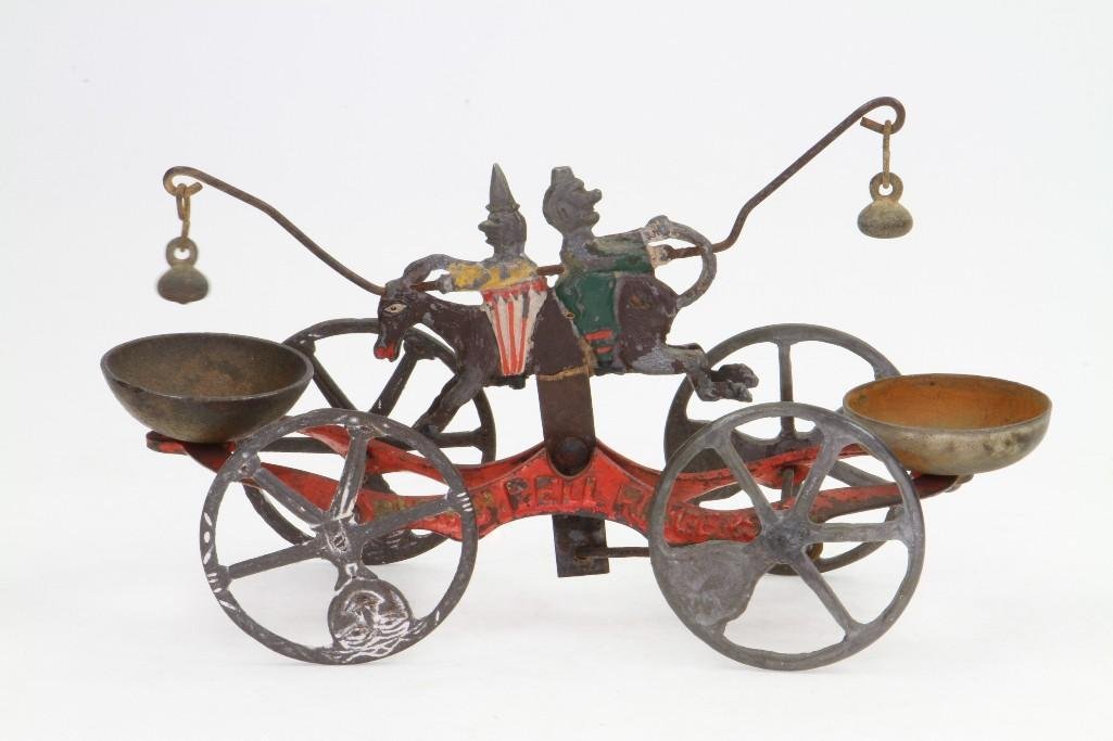 Clown Bell Ringer Pull Toy: Unknown Maker, 80% Paint Remains, No Breaks in Cast Iron; Very Good Condition, 9 1/4"L Notes:Turner Auctions + Appraisals is pleased to feature the Anita & Sedwick Hellman Toy Collection. Offerin