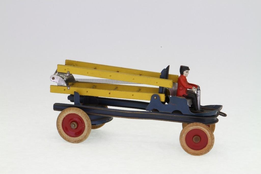 Fireman Ladder Truck: Kingsbury, Painted Pressed Steel, Wood Ladders, Rubber Tires, Cast Driver; Clockwork Powered; Excellent Condition 9 3/4"L Notes:Turner Auctions + Appraisals is pleased to feature the Anita & Sedw